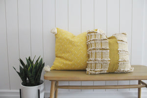 Yellow embroidered pillow w/ tassels