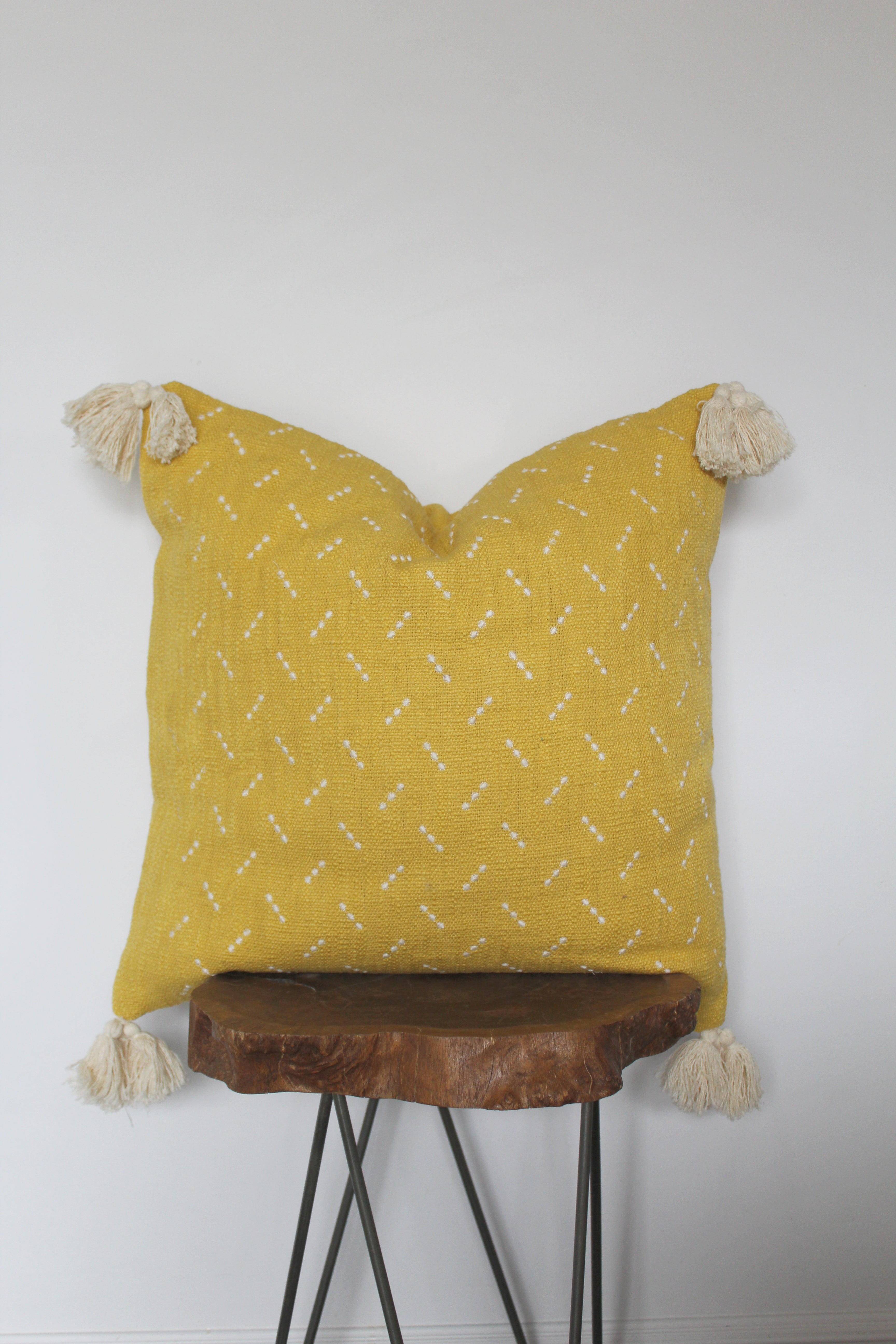 Yellow embroidered pillow w/ tassels